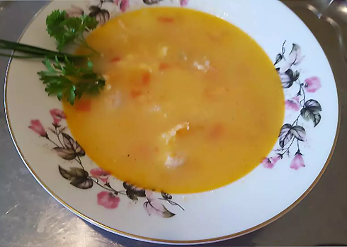 Risotto with shrimps, smoked salmon and cheese feed with greens