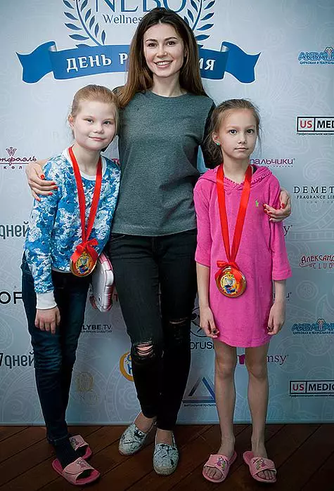 Olga Ushakov with children. .